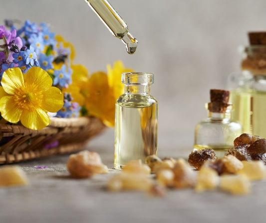 Bright flowers next to natural moisturizing oils.