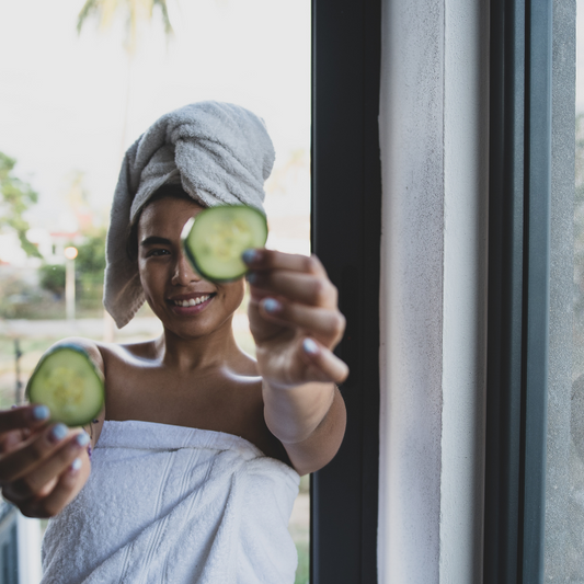 Woman at spa excited about her cucumber skincare routine